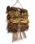 Frontal view of a 20x30cm handcrafted dried flower and wild herb wall hanging tapestry with jute fringe.
