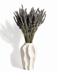 Full view of a 40cm natural dried lavender bouquet displayed in a wavy white ceramic vase.
