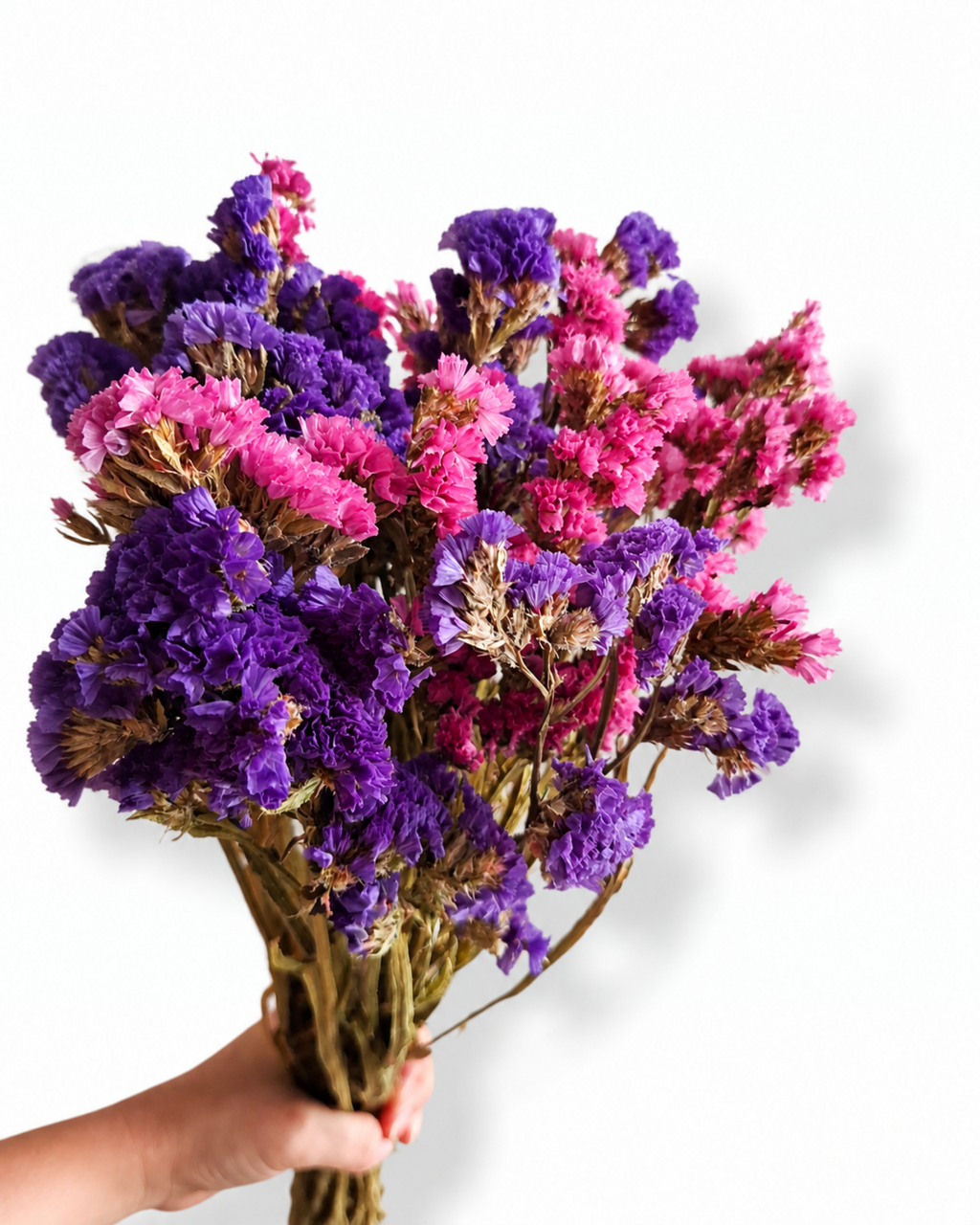 Close up of dense purple and bright pink statice heads for boho wedding floral arrangements