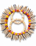 Handcrafted circular dried botanical wall hanging with a prominent number 8 shape made of cream Helichrysum flowers.
